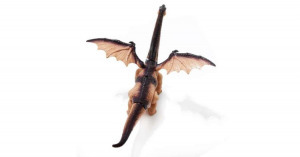 Üvöltő, lépkedő óriás szárnyas dinoszaurusz - menet közben tojást rak